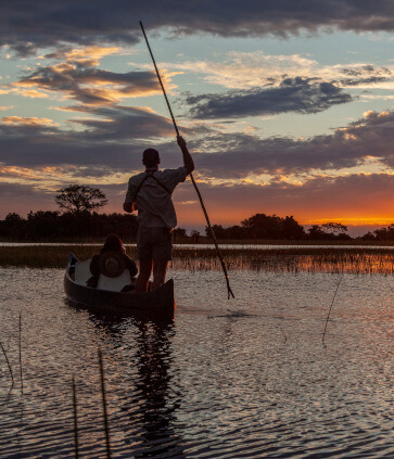 the-eco-hunter-places-to-hunt-in-namibia-caprivi-sambesi-sundowner-okavango-delta-kanoe-silhouette-experience-river