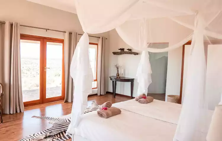 Chalet bedroom with a view at Haris hunting farm