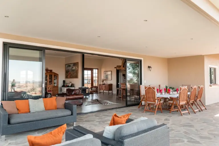 Terrace with dining table at Haris hunting lodge