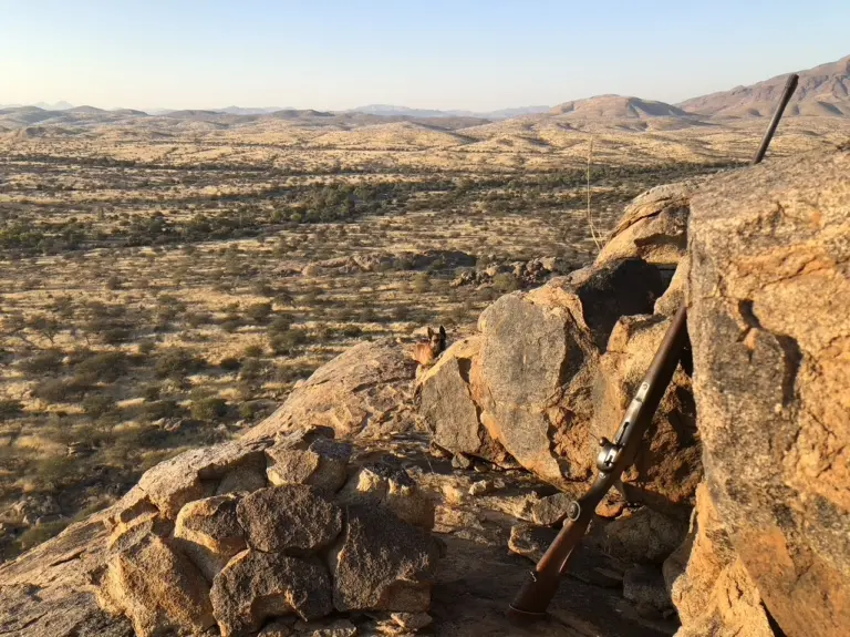 Rifle overlooking the Erongo Mountains at Reficiens